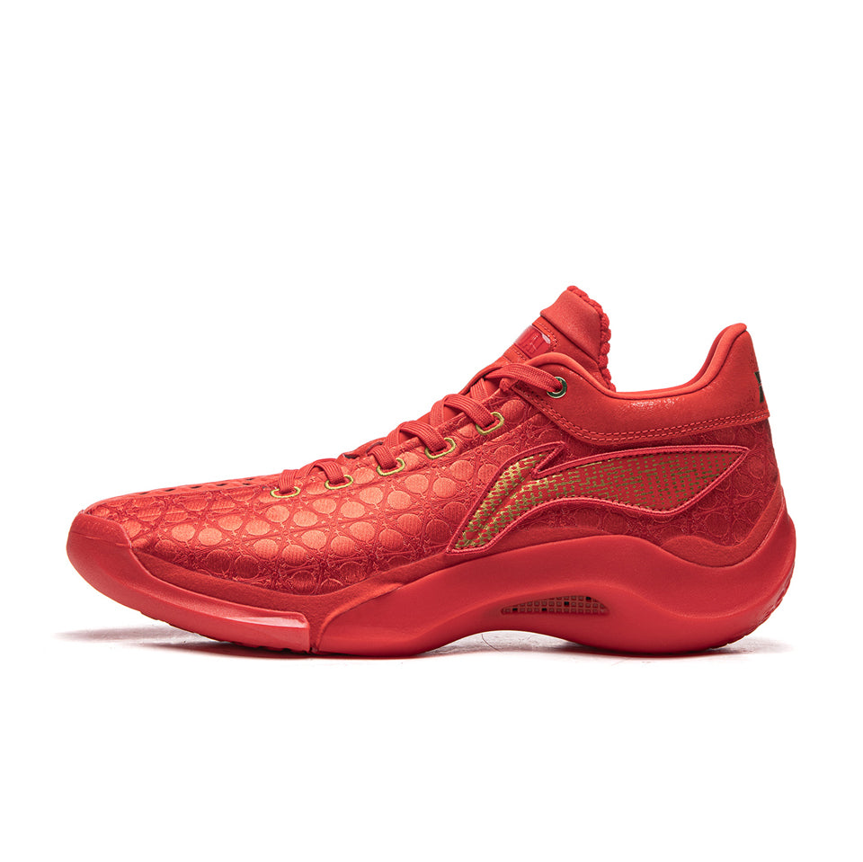 Red sneaker with gold accents on a white background